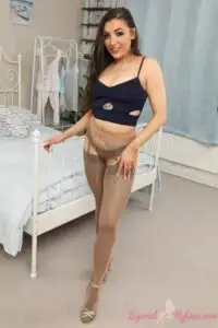 Image 8 of, Layered-Nylons Blossom in a short skirt with pantyhose over stockings