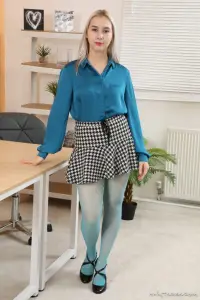 Only Tease Patricia A in a short skirt and blue pantyhose 