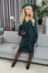 Only Tease Serenity teasing on the couch in a green skirt and pantyhose