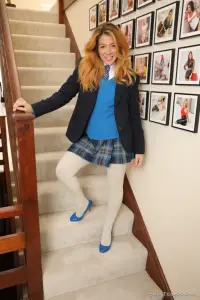 Only Tease Tillie in a college uniform and patterned tights 